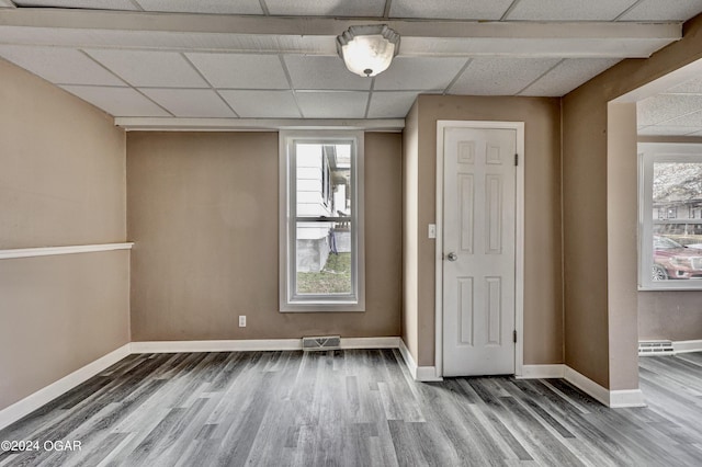 530 N Joplin Ave, Joplin, MO 64801 - unfurnished room with baseboards, a drop ceiling, wood finished floors, and visible vents