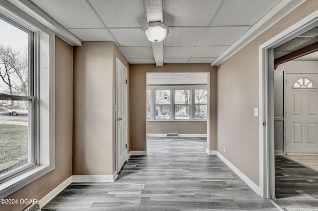 530 N Joplin Ave, Joplin, MO 64801 - hall with a healthy amount of sunlight, wood finished floors, and a paneled ceiling