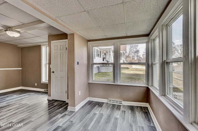 530 N Joplin Ave, Joplin, MO 64801 - spare room featuring baseboards, visible vents, a paneled ceiling, and wood finished floors
