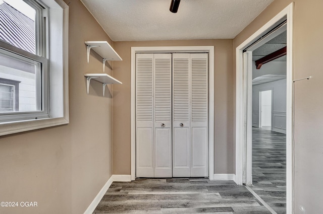 530 N Joplin Ave, Joplin, MO 64801 - interior space featuring baseboards, a textured ceiling, wood finished floors, and a healthy amount of sunlight