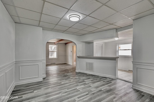 530 N Joplin Ave, Joplin, MO 64801 - interior space with arched walkways, a paneled ceiling, a wealth of natural light, wood finished floors, and visible vents