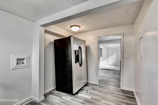 530 N Joplin Ave, Joplin, MO 64801 - hallway with light wood-style floors, baseboards, and a textured ceiling