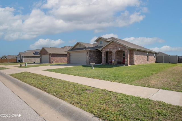 view of front of home featuring brick siding, driveway, and a garage