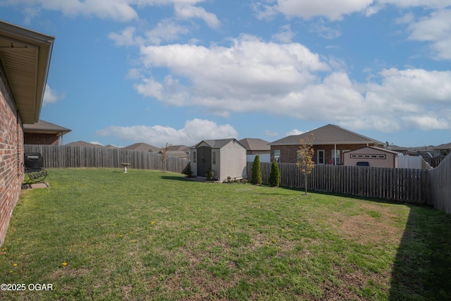 view of yard with a storage shed, an outbuilding, and a residential view
