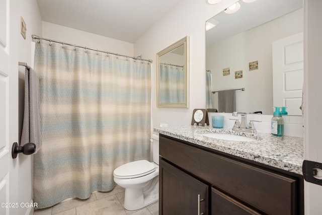 full bathroom featuring toilet and vanity