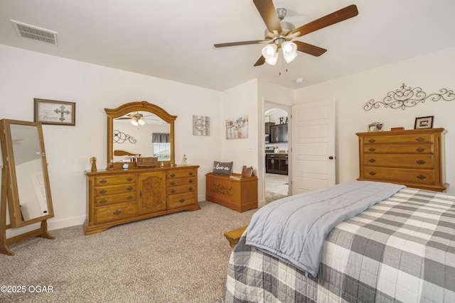bedroom featuring carpet, arched walkways, a ceiling fan, and baseboards