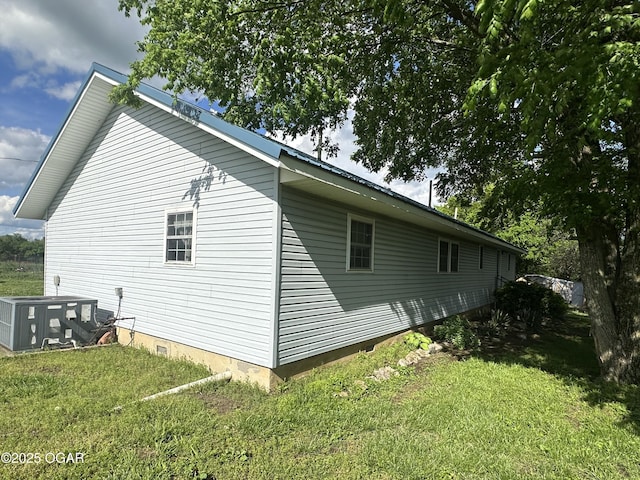 1793 8000th Rd, Oswego, KS 67356 - view of home's exterior with central air condition unit, crawl space, and a lawn