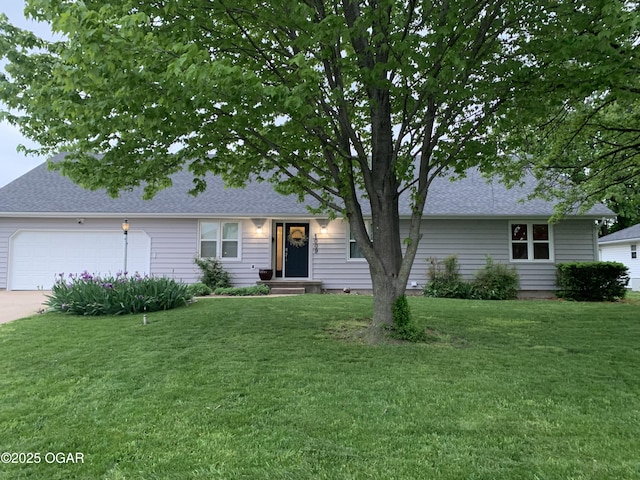 ranch-style house with roof with shingles, driveway, a front yard, and a garage