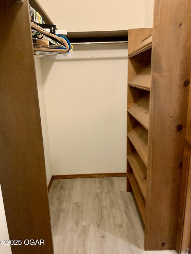 walk in closet featuring light wood-type flooring