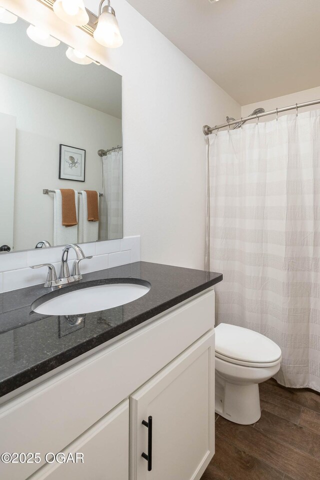 2006 Eagle Dr, Neosho, MO 64850 - full bathroom with wood finished floors, vanity, and toilet