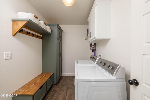 2006 Eagle Dr, Neosho, MO 64850 - laundry area featuring cabinet space, washer and dryer, dark wood finished floors, and baseboards