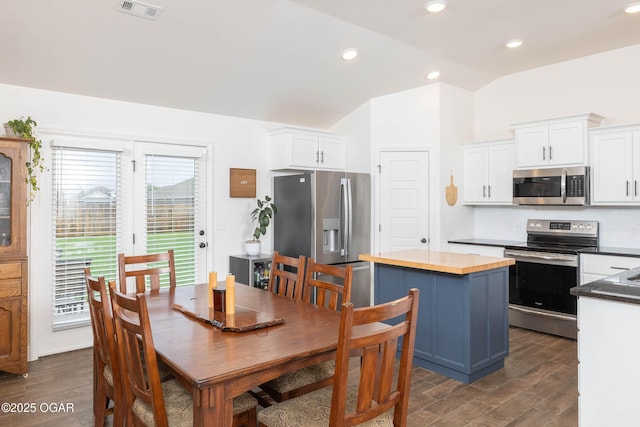 2006 Eagle Dr, Neosho, MO 64850 - dining space featuring vaulted ceiling, dark wood finished floors, and recessed lighting