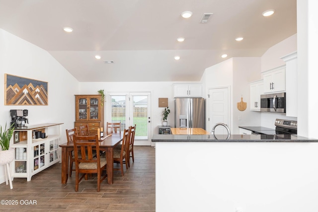 2006 Eagle Dr, Neosho, MO 64850 - dining room with vaulted ceiling, wood finished floors, and recessed lighting