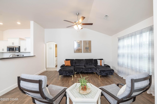 2006 Eagle Dr, Neosho, MO 64850 - living room featuring a ceiling fan, vaulted ceiling, arched walkways, and wood finished floors