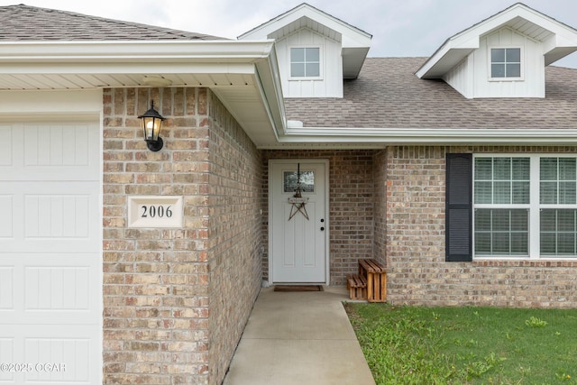 2006 Eagle Dr, Neosho, MO 64850 - doorway to property with roof with shingles and brick siding