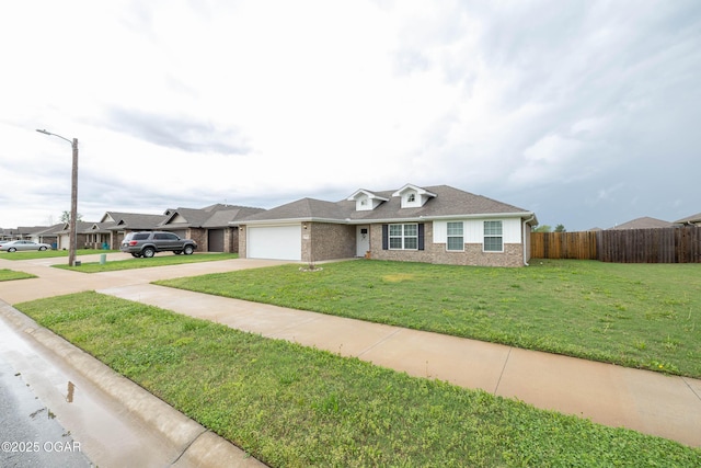 2006 Eagle Dr, Neosho, MO 64850 - view of front of home featuring concrete driveway, a garage, and brick siding