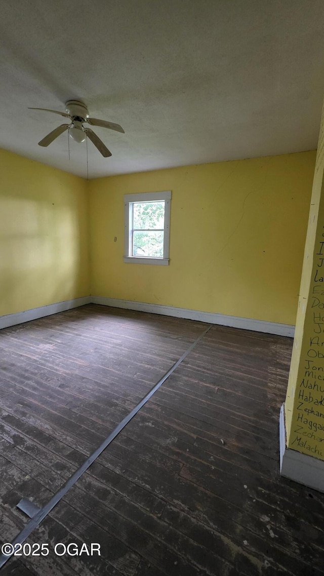 114 S Pennsylvania St, Webb City, MO 64870 - spare room with baseboards, a ceiling fan, and hardwood / wood-style flooring