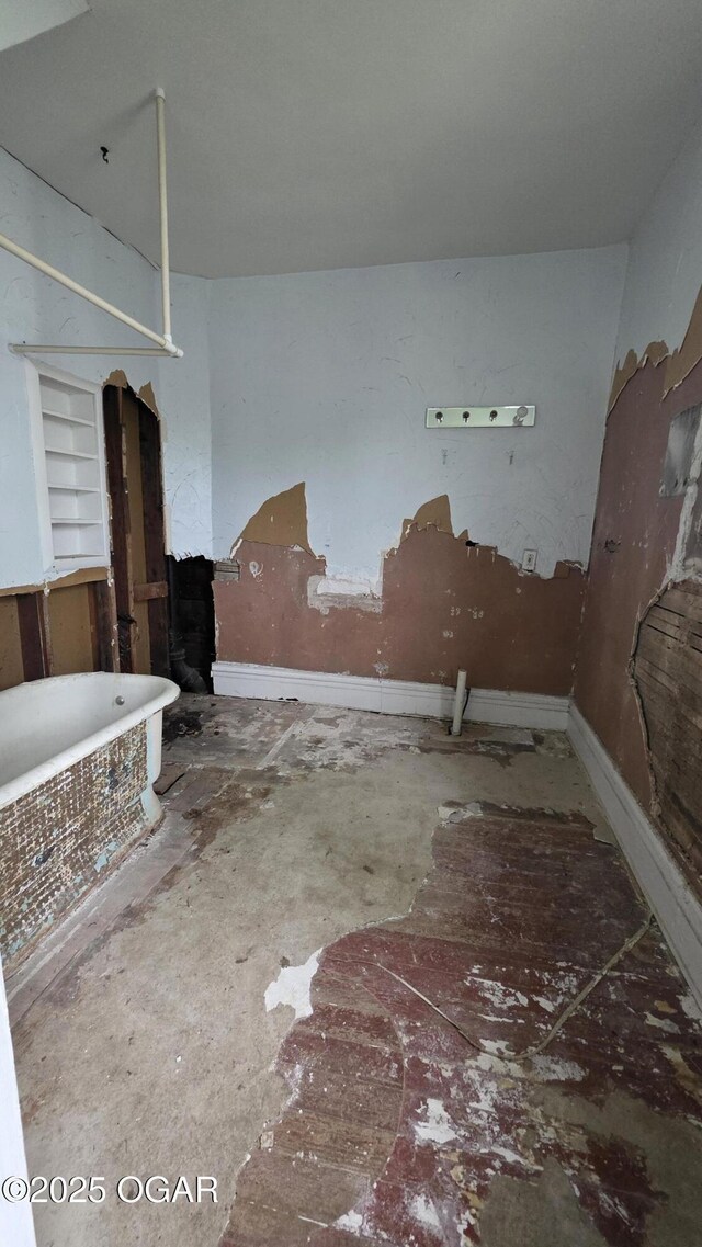 114 S Pennsylvania St, Webb City, MO 64870 - unfurnished living room featuring built in shelves and baseboards