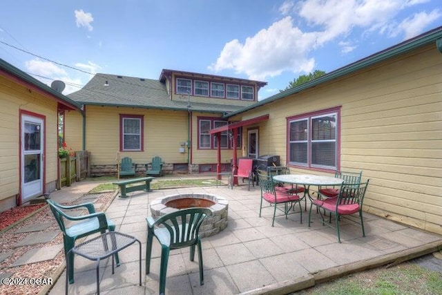 1418 Cleveland Ave, Baxter Springs, KS 66713 - view of patio / terrace featuring a fire pit