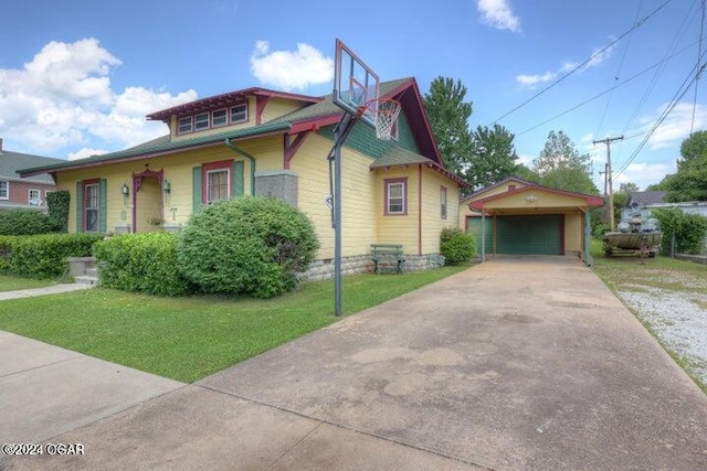 1418 Cleveland Ave, Baxter Springs, KS 66713 - view of front of property featuring an outbuilding, a garage, and a front lawn