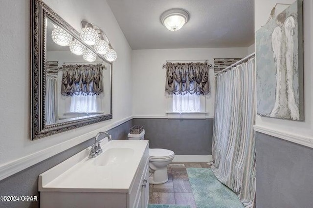1418 Cleveland Ave, Baxter Springs, KS 66713 - bathroom with vanity, toilet, and a shower with curtain