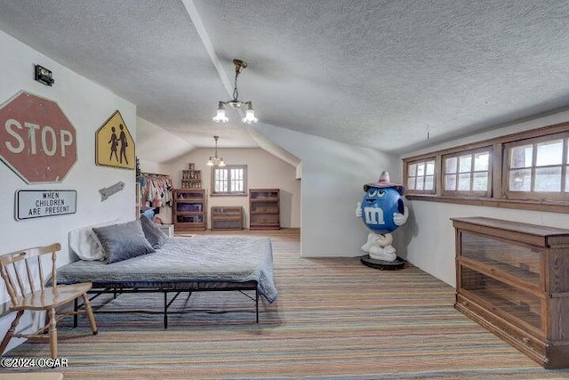 1418 Cleveland Ave, Baxter Springs, KS 66713 - carpeted bedroom with a chandelier, a textured ceiling, and vaulted ceiling