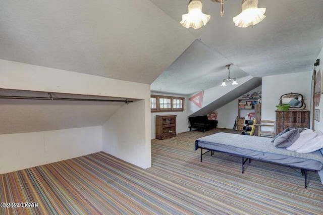 1418 Cleveland Ave, Baxter Springs, KS 66713 - spacious closet featuring carpet, vaulted ceiling, and a chandelier