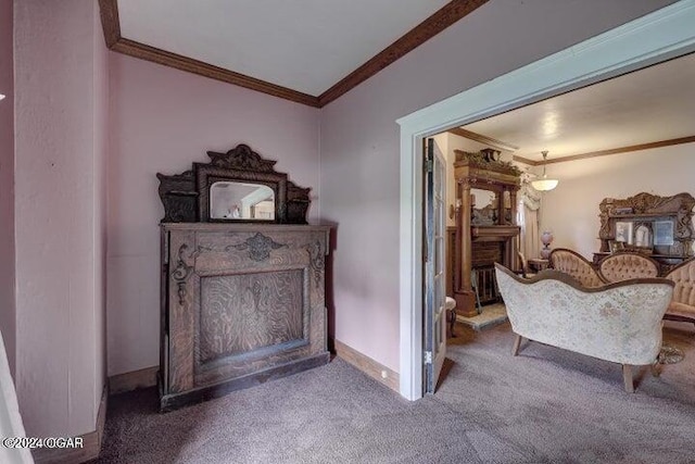 1418 Cleveland Ave, Baxter Springs, KS 66713 - living area featuring crown molding, carpet floors, a fireplace, and baseboards