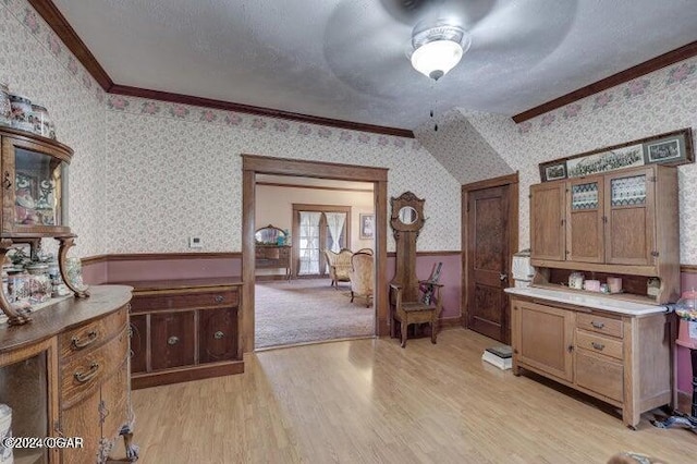 1418 Cleveland Ave, Baxter Springs, KS 66713 - bathroom featuring wallpapered walls, a wainscoted wall, wood finished floors, ornamental molding, and a textured ceiling