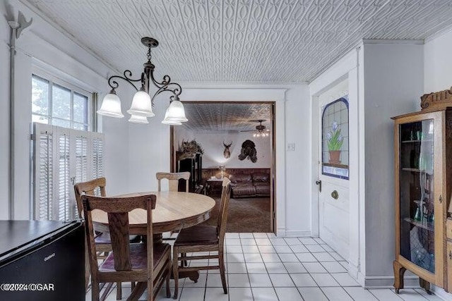 1418 Cleveland Ave, Baxter Springs, KS 66713 - dining area with a chandelier and light tile patterned floors