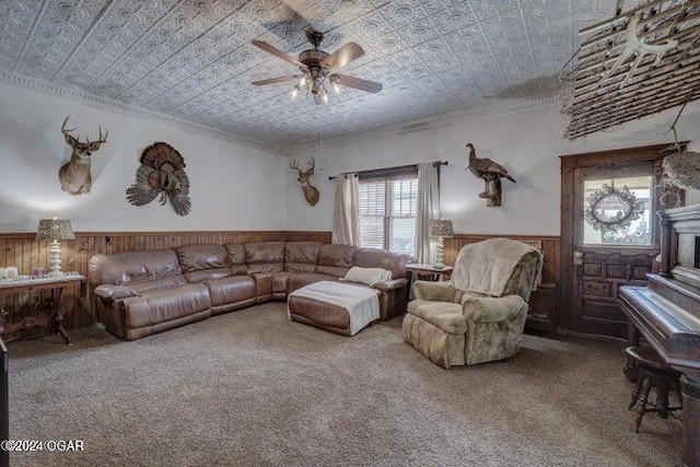 1418 Cleveland Ave, Baxter Springs, KS 66713 - living room with wainscoting, plenty of natural light, crown molding, ceiling fan, and carpet