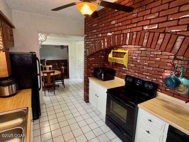 1418 Cleveland Ave, Baxter Springs, KS 66713 - kitchen with black appliances, a ceiling fan, light countertops, light tile patterned flooring, and ornamental molding