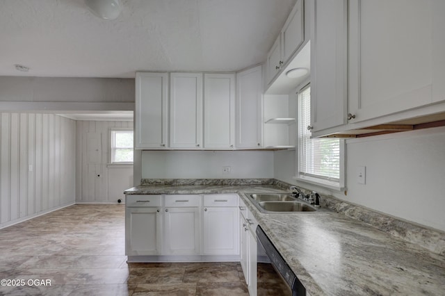 kitchen featuring white cabinets, open shelves, a sink, and dishwasher