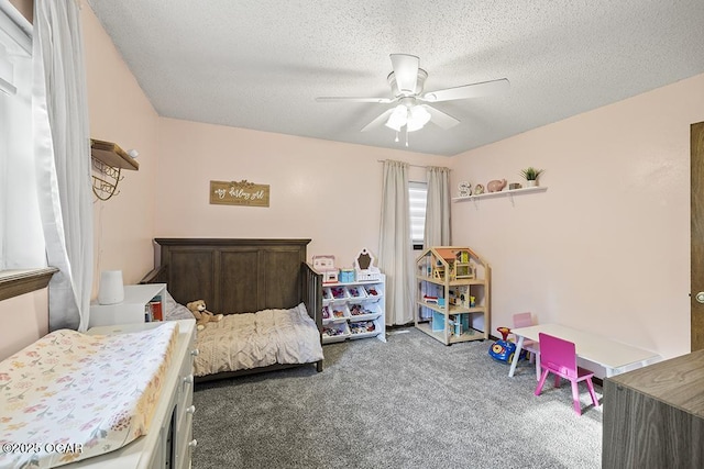bedroom with carpet flooring, a textured ceiling, and ceiling fan