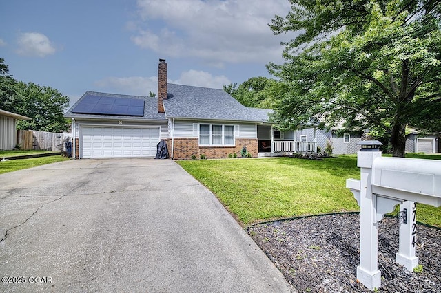 3724 Hawthorn Dr, Joplin, MO 64804 - ranch-style home featuring brick siding, concrete driveway, a garage, a front yard, and solar panels