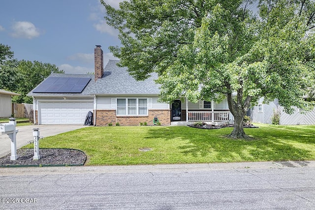 3724 Hawthorn Dr, Joplin, MO 64804 - view of front of house with a porch, brick siding, a garage, roof mounted solar panels, and a front lawn