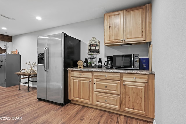 400 Silverwood Ln, Joplin, MO 64801 - kitchen with stainless steel fridge with ice dispenser, black microwave, wood finished floors, recessed lighting, and light brown cabinetry