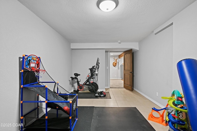 400 Silverwood Ln, Joplin, MO 64801 - workout room featuring baseboards, a textured ceiling, and tile patterned floors