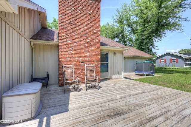 400 Silverwood Ln, Joplin, MO 64801 - wooden deck with a trampoline and a yard