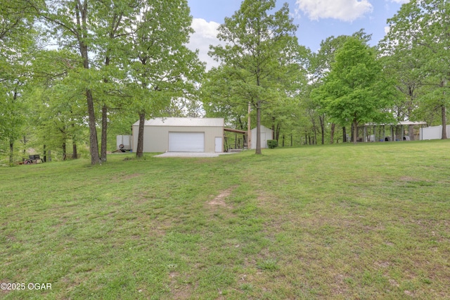 4537 Dolphin Dr, Joplin, MO 64804 - view of yard with a garage and an outbuilding
