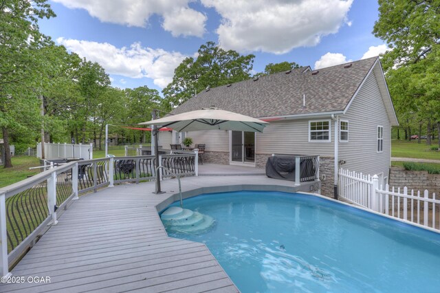 4537 Dolphin Dr, Joplin, MO 64804 - outdoor pool featuring a patio, fence, and a wooden deck