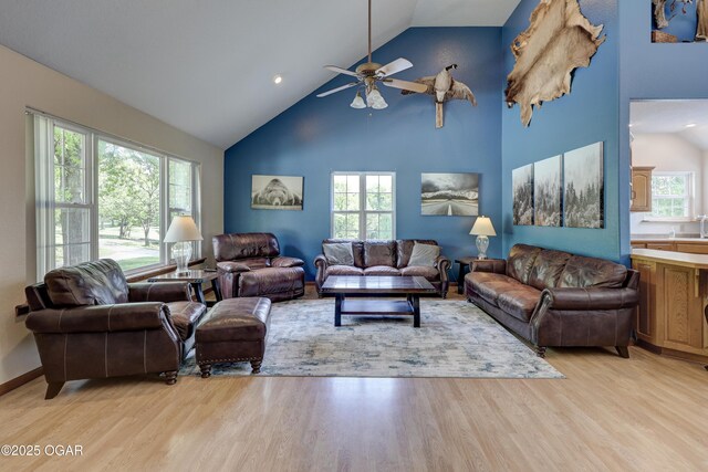 4537 Dolphin Dr, Joplin, MO 64804 - living room with ceiling fan, high vaulted ceiling, light wood finished floors, and recessed lighting