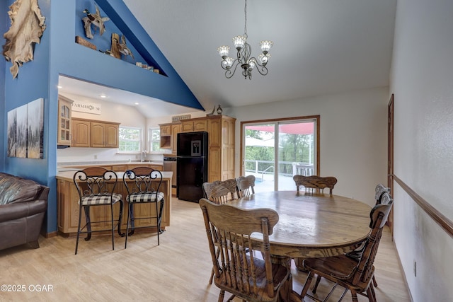 4537 Dolphin Dr, Joplin, MO 64804 - dining space featuring recessed lighting, an inviting chandelier, high vaulted ceiling, and light wood-style flooring