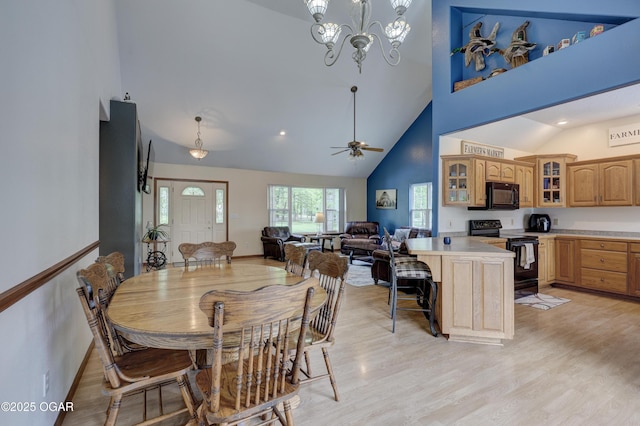 4537 Dolphin Dr, Joplin, MO 64804 - dining room with recessed lighting, light wood finished floors, high vaulted ceiling, and ceiling fan with notable chandelier