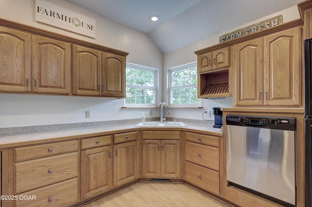 4537 Dolphin Dr, Joplin, MO 64804 - kitchen with light countertops, a sink, dishwasher, light wood-style floors, and lofted ceiling