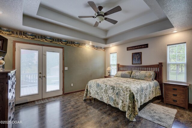 4537 Dolphin Dr, Joplin, MO 64804 - bedroom with french doors, wood finished floors, a ceiling fan, a raised ceiling, and access to exterior