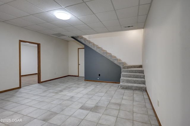 4537 Dolphin Dr, Joplin, MO 64804 - finished basement with stairway, baseboards, visible vents, and a drop ceiling