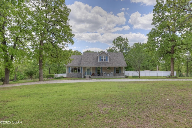 4537 Dolphin Dr, Joplin, MO 64804 - new england style home with a porch, curved driveway, a front lawn, and fence