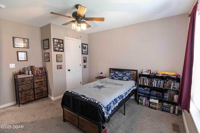 bedroom featuring carpet flooring, baseboards, a ceiling fan, and visible vents