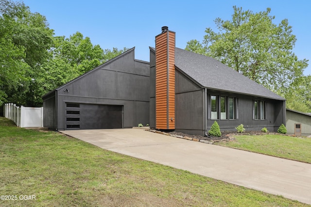 1214 Bramar Dr, Joplin, MO 64804 - modern home featuring driveway, a chimney, an attached garage, and a shingled roof